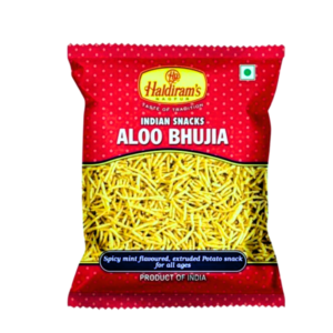 Haldiram's Aloo Bhujia – 42g The Crunchy Legend of Indian Snacking Product Description: Experience the iconic taste of India with Haldiram's Aloo Bhujia - a crispy, savory snack made from premium quality potatoes and besan (gram flour). This 42g pack delivers the perfect balance of spices and crunch that made Haldiram's a household name